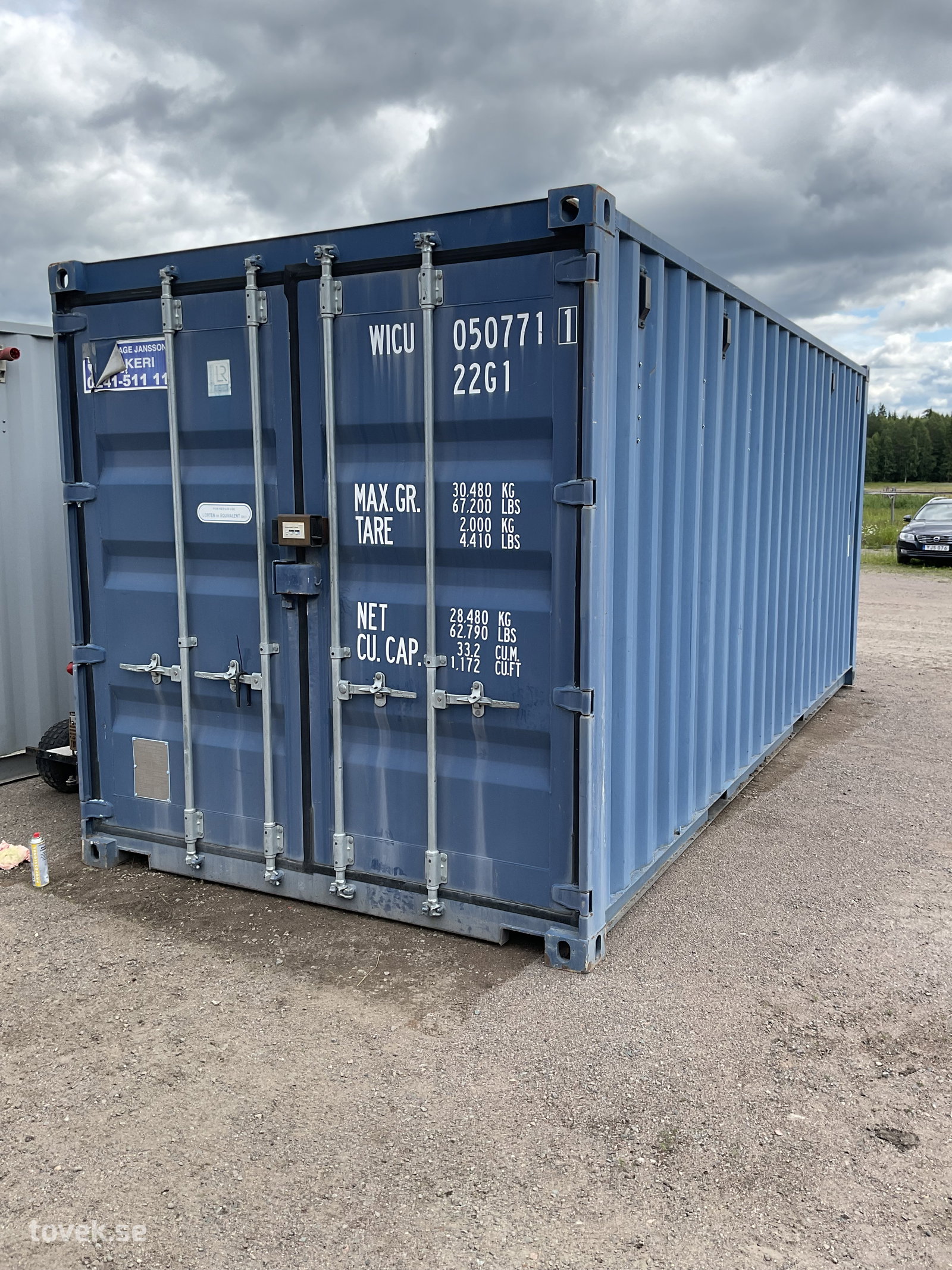 Container blå 20 fot, inkl innehåll